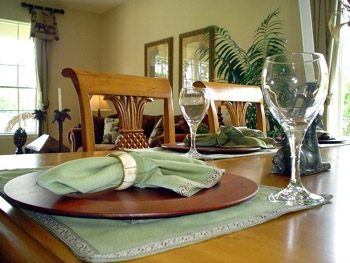 This photo - representative of dining at home in simple, yet elegant style was taken by an unknown photographer.